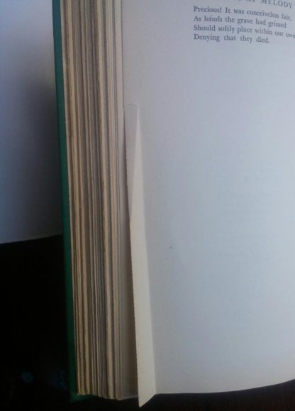 page with a bend in a 1945 First Edition of Bolts of Melody by Emily Dickinson