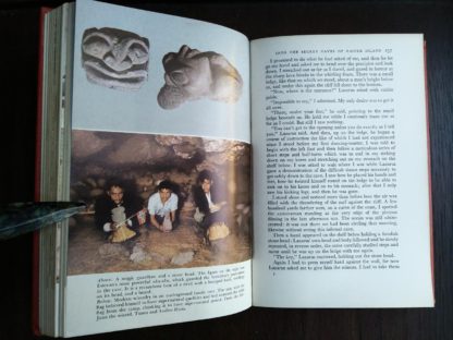 photographs of a magic guardian head and of an underground family cave in a 1958 First Edition of Aku-Aku, The Secret Of Easter Island
