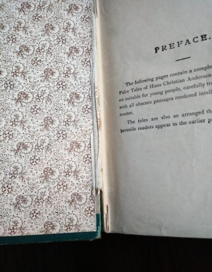 damage to the upper and lower seam in an Antique Caxton Edition of Andersens Fairy Tales
