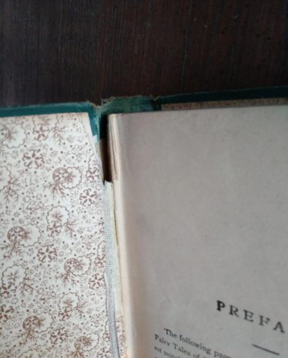 seam damage in an Antique Caxton Edition of Andersens Fairy Tales