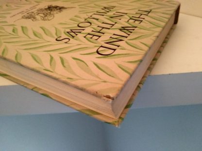 1954 copy of The Wind in the Willows illustrated by Ernest Shepard bumping to top right corner