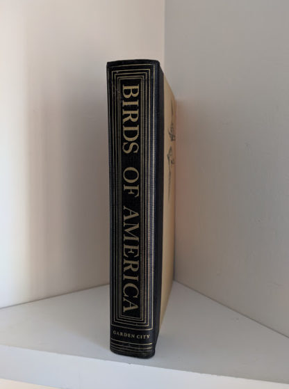spine view on a 1936 copy of BIRDS OF AMERICA with 106 Color Plates published by Doubleday & Company