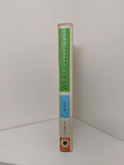 spine view of a 1962 copy of The Wizard of Oz published by Macmillan Company with illustrations by Denslow