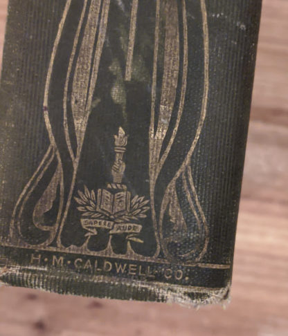bottom of the spine - Sapere Aude - 1900 copy of The Three Musketeers by Alexandre Dumas - Published by Caldwell Company Publishers
