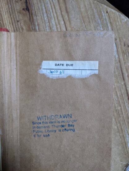 ex library markings on front endpaper inside a 1916 copy of The Emigrant by Dostoieff Skaya