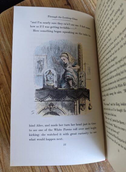 I feel somehow as if I was getting invisible - illustration by John Tenniel inside a 1946 Through The Looking-Glass - Two Volumes - by Lewis Carroll. Published by Random House, New York - Special Edition