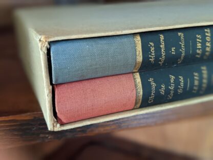 top edge of a books in slipcase - 1946 Alice’s Adventures in Wonderland and Through The Looking-Glass - Two Volumes - by Carroll Lewis. Published by Random House, New York - Special Edition
