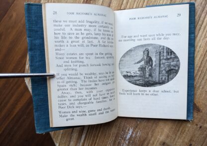 Illustrated black and white oval plate inside a copy of Poor Richard's Almanac by Benjamin Franklin - The Gold Medal Library pocket book - undated